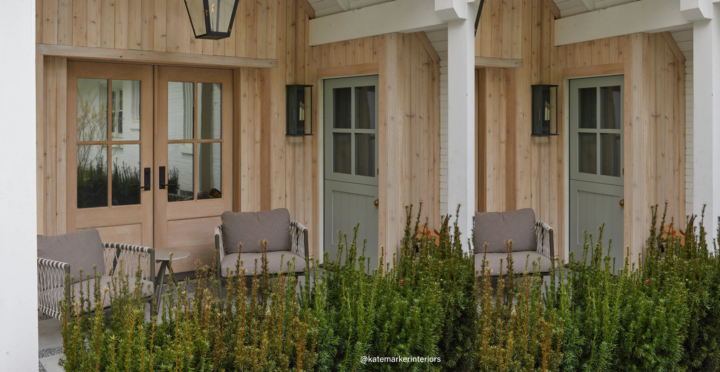 Outdoor seating with gray chairs, light green Dutch doors, and raw wood double doors